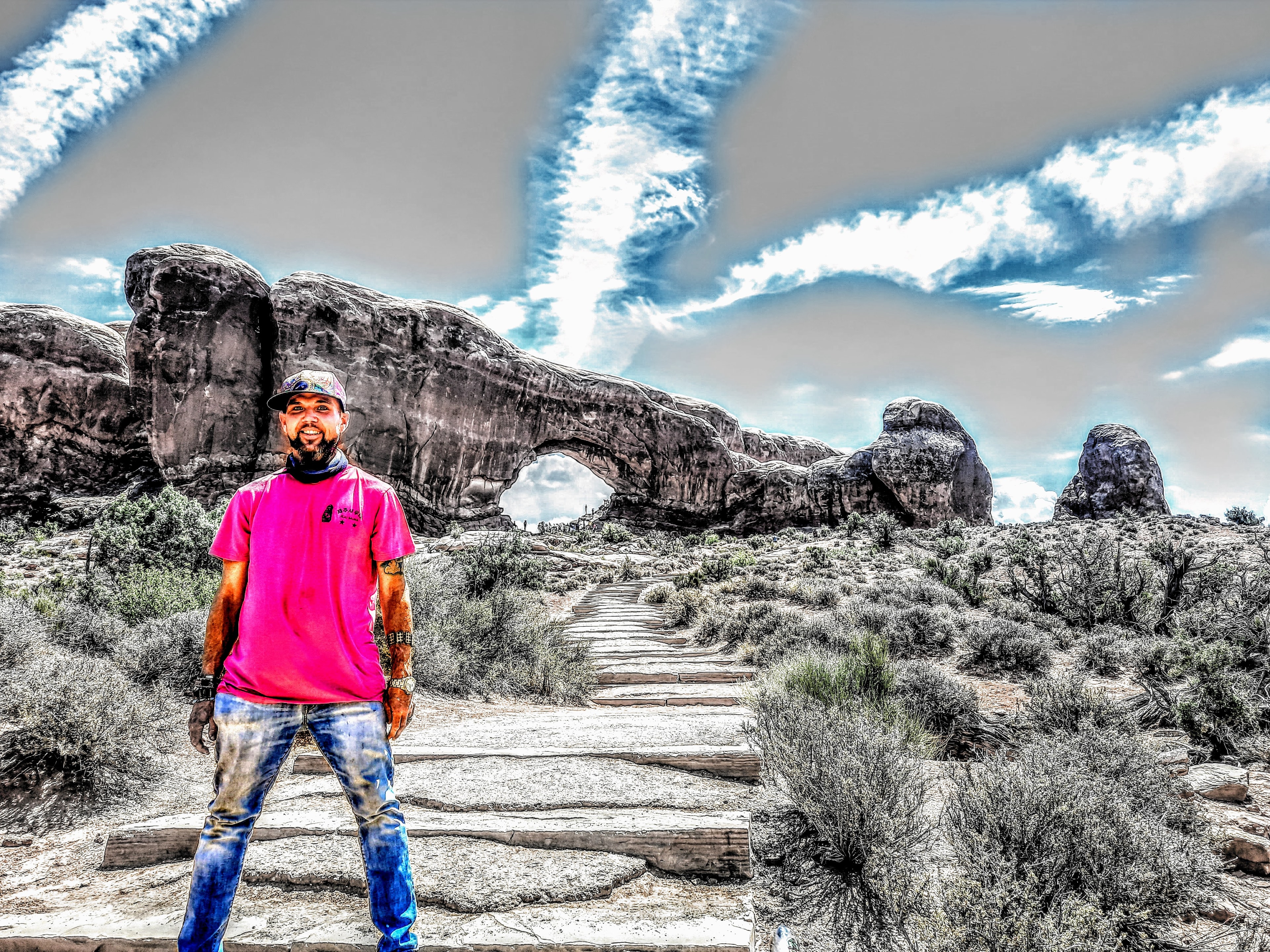 Freebird Astro-Naughty desert portrait, colorful jacket and pink shades